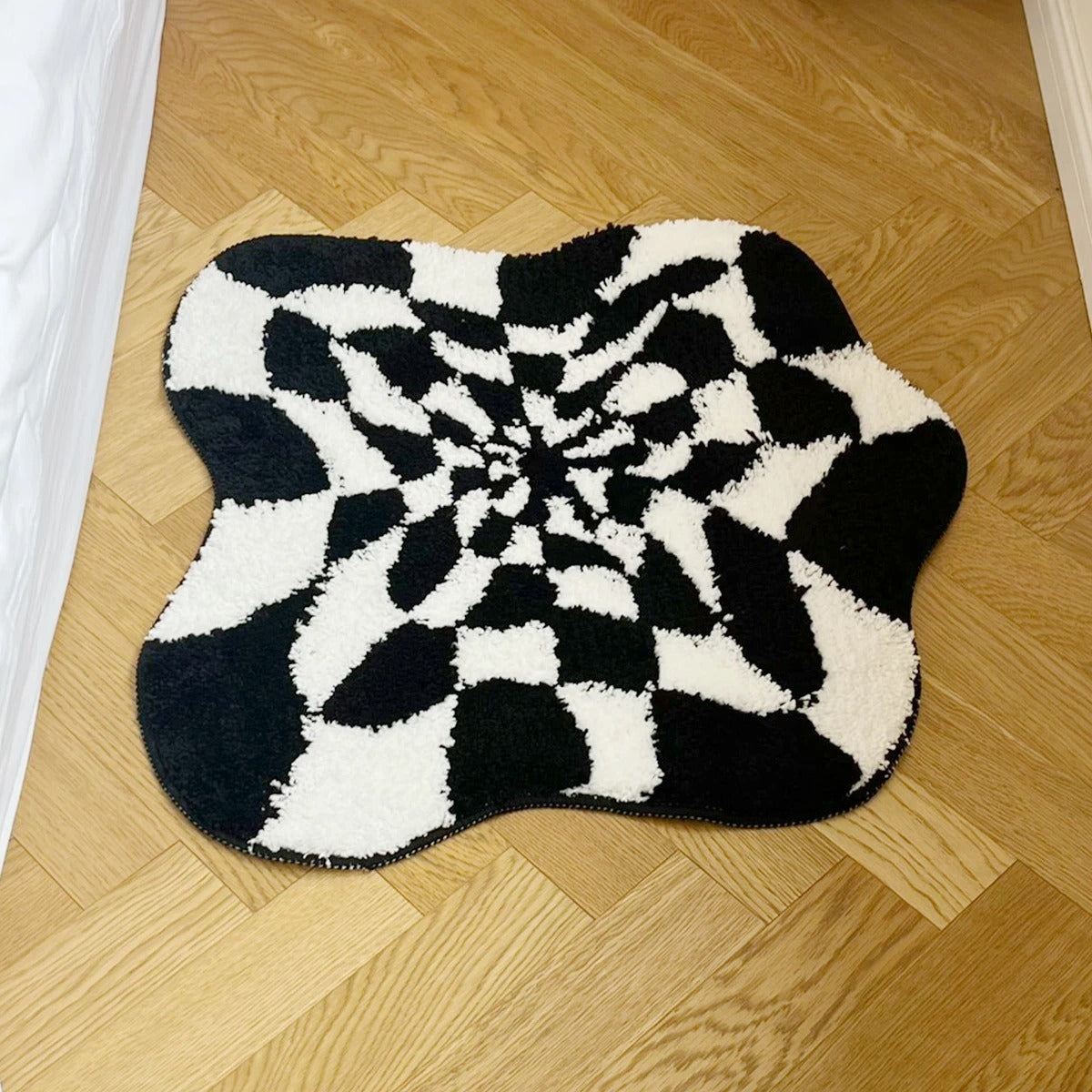 Wavy Checkered Black & White Optical Illusion Rug — Soft Accent Rug for Bedroom Layering — Lifestyle 1